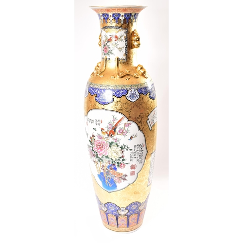 128 - A large 21st century Chinese style gilt & enamelled metal floor vase. The vase having a flared rim o... 