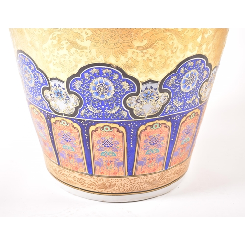 128 - A large 21st century Chinese style gilt & enamelled metal floor vase. The vase having a flared rim o... 