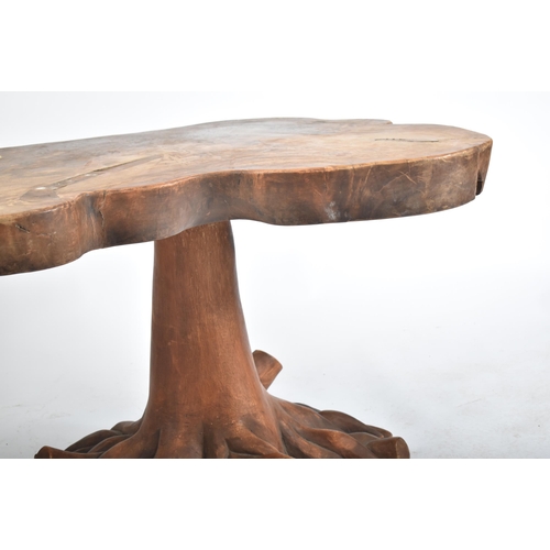 135 - A vintage 20th century Java wood & composite tree root side occasional table. The table having a Jav... 