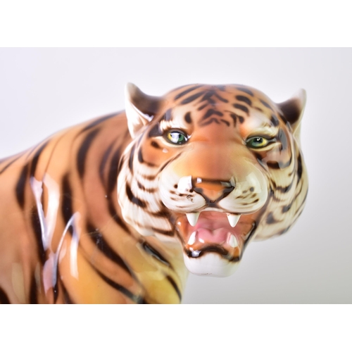 14 - A large 20th century 1960s Italian floor standing ceramic tiger. The tiger (Lionel) in the seated po... 