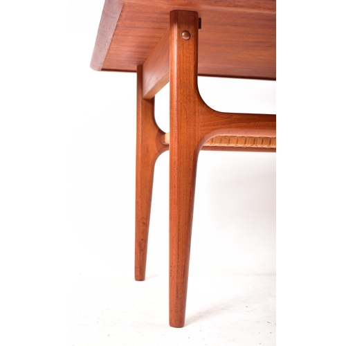 145 - Trioh Mobler - A 20th century 1960s Danish square topped teak wood coffee / side table. The table ra... 