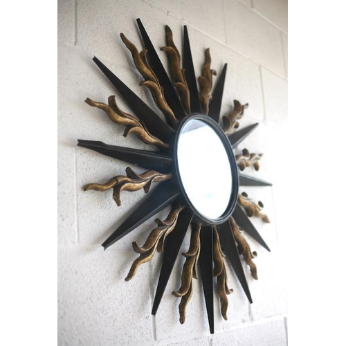 149 - A large vintage 20th century metal worked wall hanging sunburst mirror. Central circular mirror plat... 