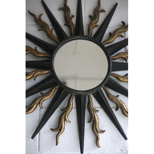 149 - A large vintage 20th century metal worked wall hanging sunburst mirror. Central circular mirror plat... 