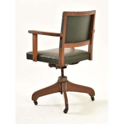 15 - Hillcrest - An early 20th century 1930s beech & green leather upholstered swivel office chair. The c... 