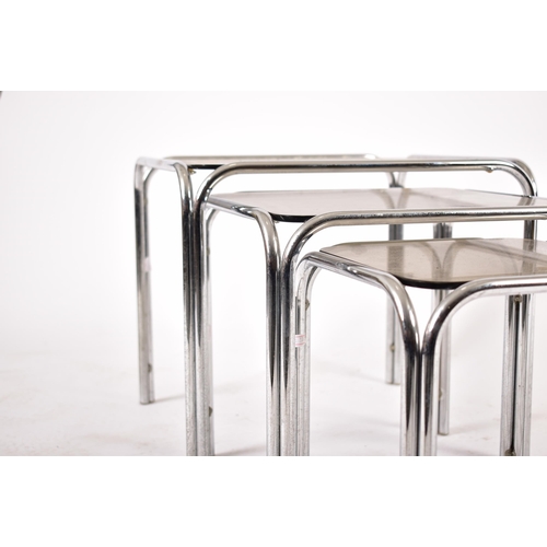 172 - A retro 20th century 1970s chrome and smoked glass nest of tables. Each nesting table having chrome ... 