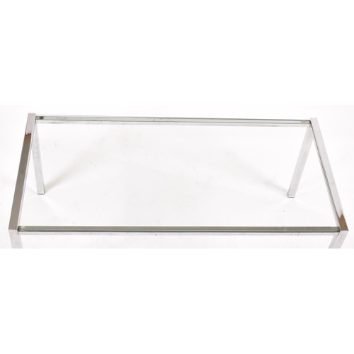 174 - A retro 20th century 1970s chrome and clear glass coffee table / low table. The table of rectangular... 