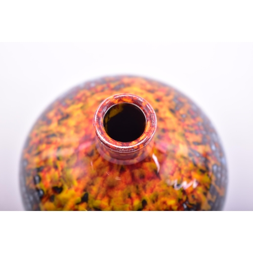 177 - Poole Pottery - a vintage late 20th century ceramic bud vase. The vase in hues of reds, ochres & blu... 