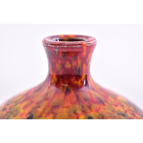 177 - Poole Pottery - a vintage late 20th century ceramic bud vase. The vase in hues of reds, ochres & blu... 