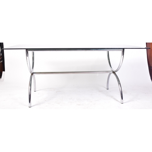 203 - A retro 20th century 1970s designer chrome and and smoked glass dining table and matching four chair... 