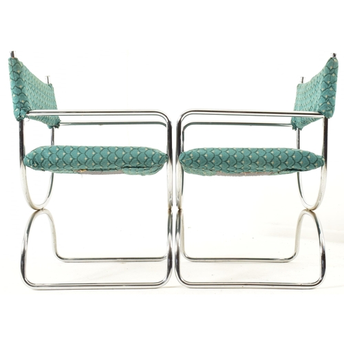 203 - A retro 20th century 1970s designer chrome and and smoked glass dining table and matching four chair... 