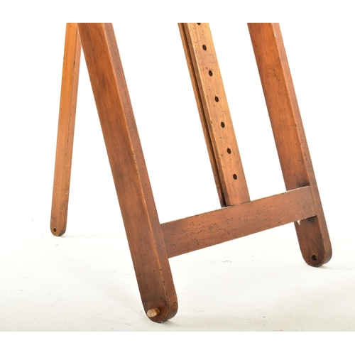 217 - A large vintage late 20th century wooden artist's easel. The easel having adjustable canvas holder a... 