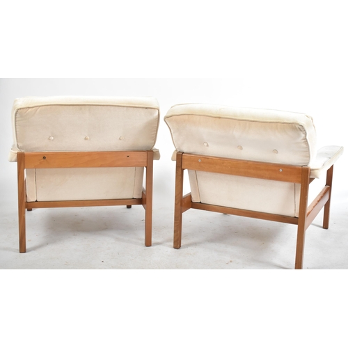 222 - Guy Rogers - A pair retro 20th century British design teak framed armchairs / easy lounge chairs. Ea... 