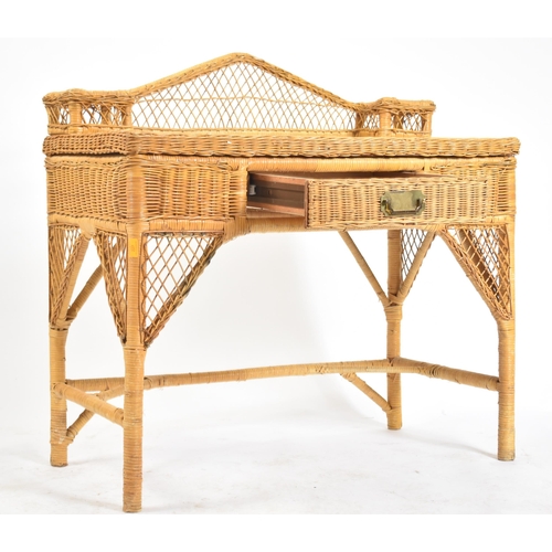 227 - A vintage 20th century wicker rattan writing office desk in the manner of Henry Link. The desk havin... 