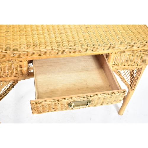 227 - A vintage 20th century wicker rattan writing office desk in the manner of Henry Link. The desk havin... 