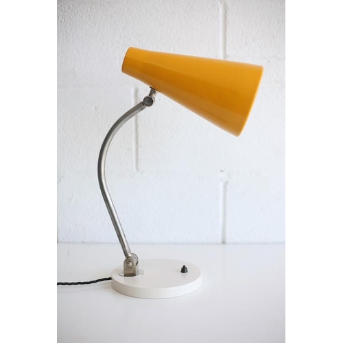 228 - A vintage 20th century 1950s desk / table lamp light. The lamp having a vibrant yellow conical shade... 