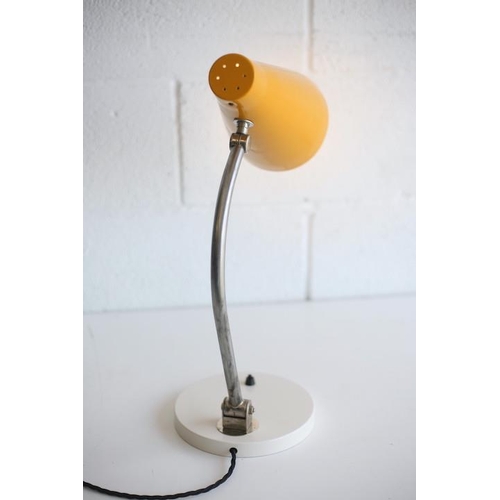 228 - A vintage 20th century 1950s desk / table lamp light. The lamp having a vibrant yellow conical shade... 