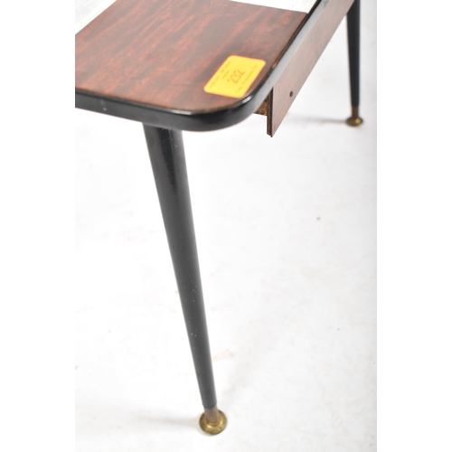 232 - A vintage mid 20th century single drawer coffee / low table. The table having a chequered formica to... 