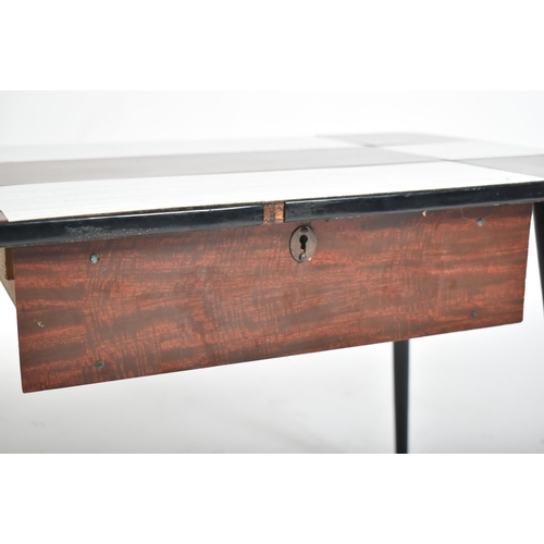 232 - A vintage mid 20th century single drawer coffee / low table. The table having a chequered formica to... 