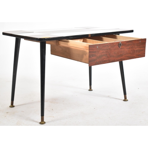 232 - A vintage mid 20th century single drawer coffee / low table. The table having a chequered formica to... 