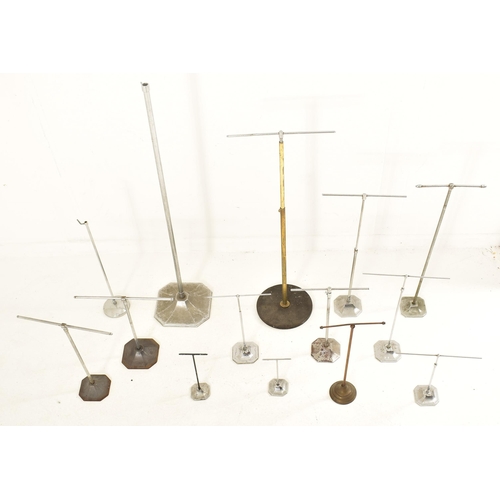 242 - A collection of early 20th century milliner's display stands, used for hats, wigs & scarves. Fourtee... 