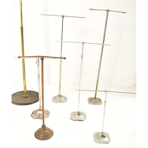 242 - A collection of early 20th century milliner's display stands, used for hats, wigs & scarves. Fourtee... 