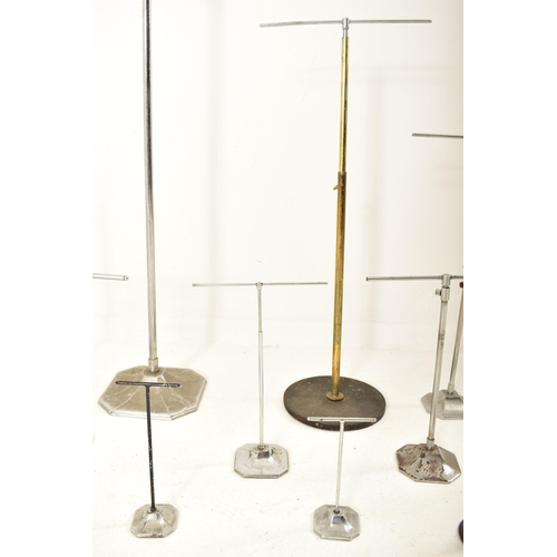 242 - A collection of early 20th century milliner's display stands, used for hats, wigs & scarves. Fourtee... 