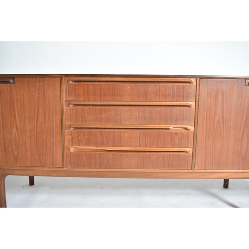 247 - A. H. Mcintosh & Co - A retro 20th century teak wood sideboard credenza. The sideboard having a cent... 