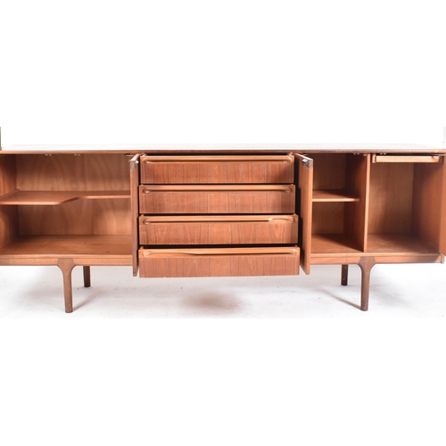 247 - A. H. Mcintosh & Co - A retro 20th century teak wood sideboard credenza. The sideboard having a cent... 