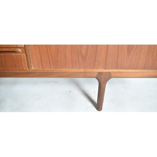 247 - A. H. Mcintosh & Co - A retro 20th century teak wood sideboard credenza. The sideboard having a cent... 