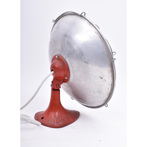 267 - A mid 20th century aluminium and cast iron heat lamp having been converted to a table lamp light. Th... 