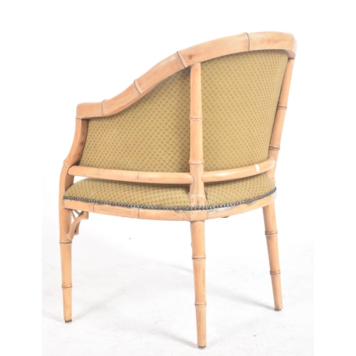 288 - A vintage 20th century faux bamboo tub armchair. The chair having a curved backrest with faux bamboo... 