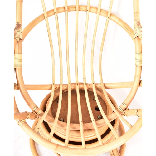 298 - A pair of retro 20th century bamboo and wicker / cane swivel armchair / egg chairs. Each chair havin... 