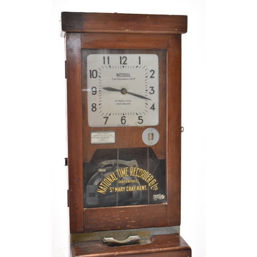 320 - National Time Recorder Co Ltd. - A vintage 20th century oak cased clocking in and out timepiece. The... 