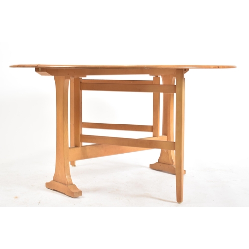 321 - Lucian Ercolani - Ercol - Model 610 -  A 20th century beech and elm wood drop leaf / gate leg dining... 