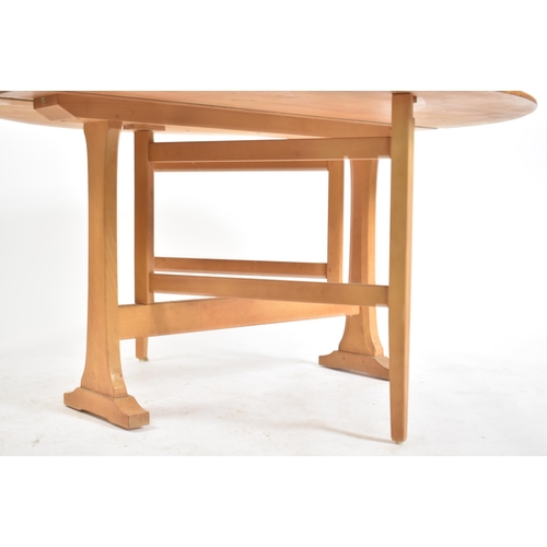 321 - Lucian Ercolani - Ercol - Model 610 -  A 20th century beech and elm wood drop leaf / gate leg dining... 