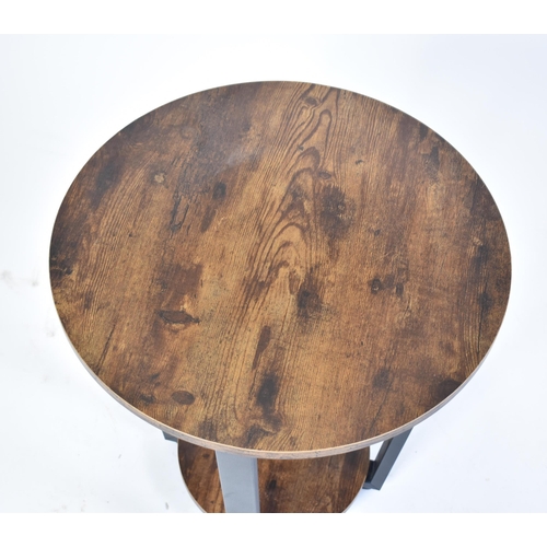 324 - A contemporary Art Deco influenced occasional / lamp table. The table having a circular top supporte... 