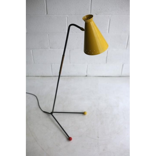 325 - A retro mid century 1950s atomic floor standing lamp light. The lamp having a yellow pendant perfora... 