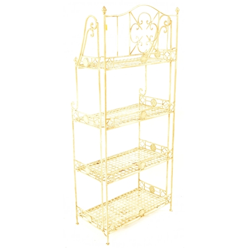 328 - A 20th century painted wrought metal bakers set of shelves. The shelves of folding form with metal w... 