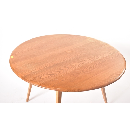 330 - Lucian Ercolani for Ercol Furniture - A retro 20th century Windsor pattern beech and elm drop-leaf d... 