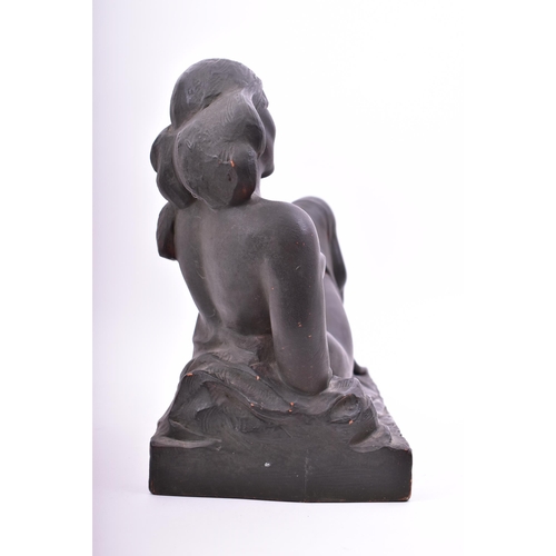 331 - An early 20th century French Art Deco style black painted terracotta reclining nude lady. Signed Ham... 