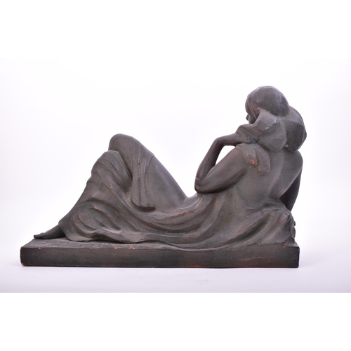 331 - An early 20th century French Art Deco style black painted terracotta reclining nude lady. Signed Ham... 