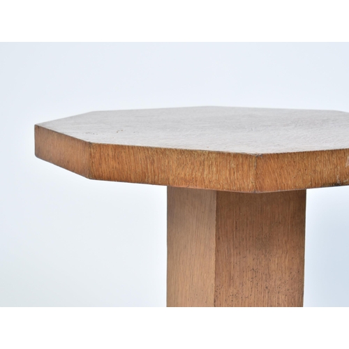 338 - A vintage 20th century Art Deco oak occasional / lamp table. The table of low form having an octagon... 