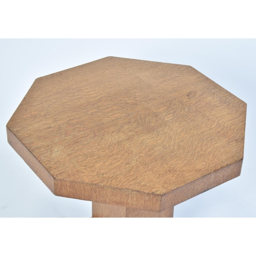 338 - A vintage 20th century Art Deco oak occasional / lamp table. The table of low form having an octagon... 