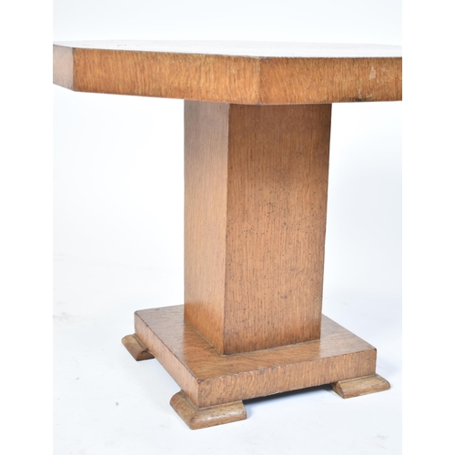 338 - A vintage 20th century Art Deco oak occasional / lamp table. The table of low form having an octagon... 