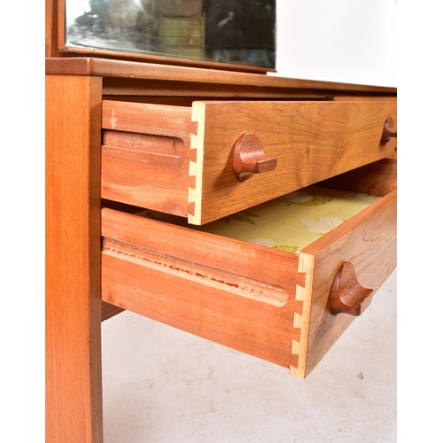 343 - Stag - A retro mid 20th century British designed teak dressing table chest. The dressing table havin... 