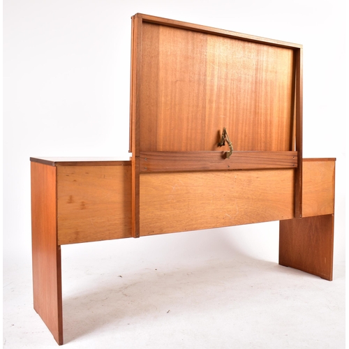 343 - Stag - A retro mid 20th century British designed teak dressing table chest. The dressing table havin... 