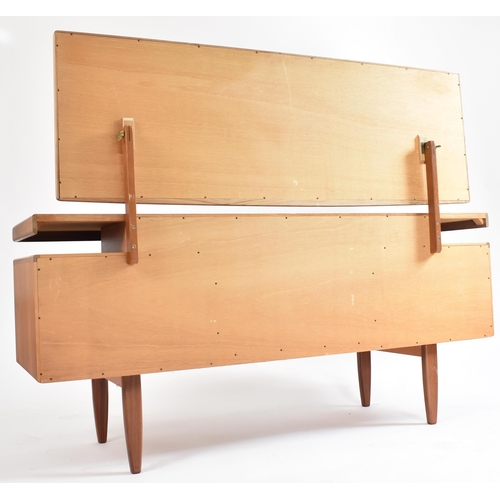 343 - Stag - A retro mid 20th century British designed teak dressing table chest. The dressing table havin... 