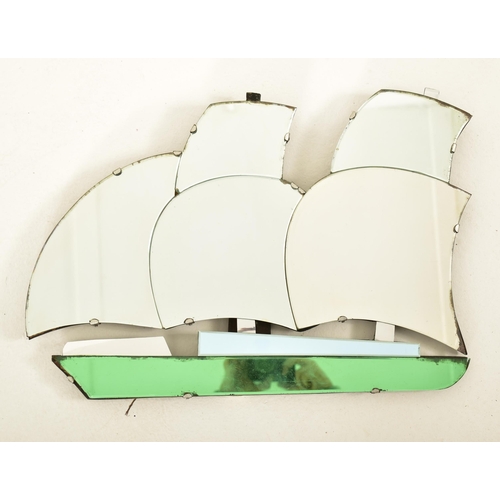 361 - An early 20th century circa 1930s Art Deco style wall mirror in the shape of a galleon ship. The boa... 