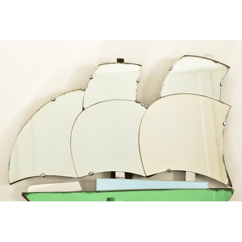 361 - An early 20th century circa 1930s Art Deco style wall mirror in the shape of a galleon ship. The boa... 