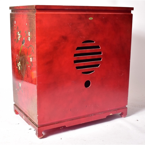 382 - A 20th century Japanese influence red lacquered media tv unit cabinet. The cabinet having a squared ... 